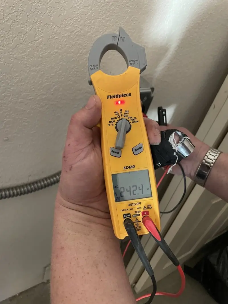 Voltage testing with clamp meter during Outlet Installation in Mount Olive